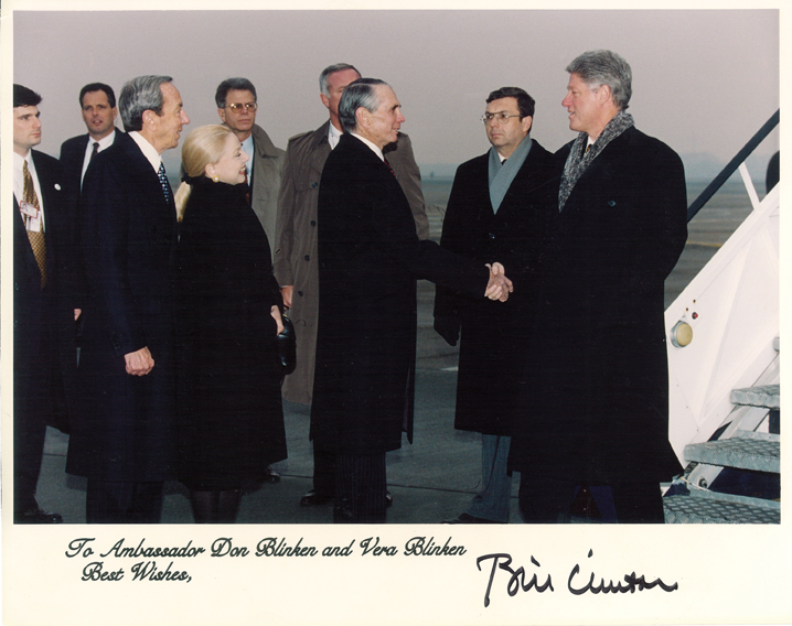 Greeting President Clinton outside Air Force One